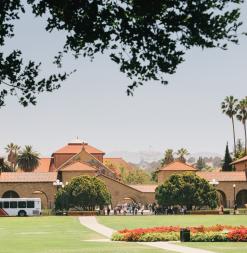 The Marguerite Bus passes by the Oval in front of Memorial Quad.